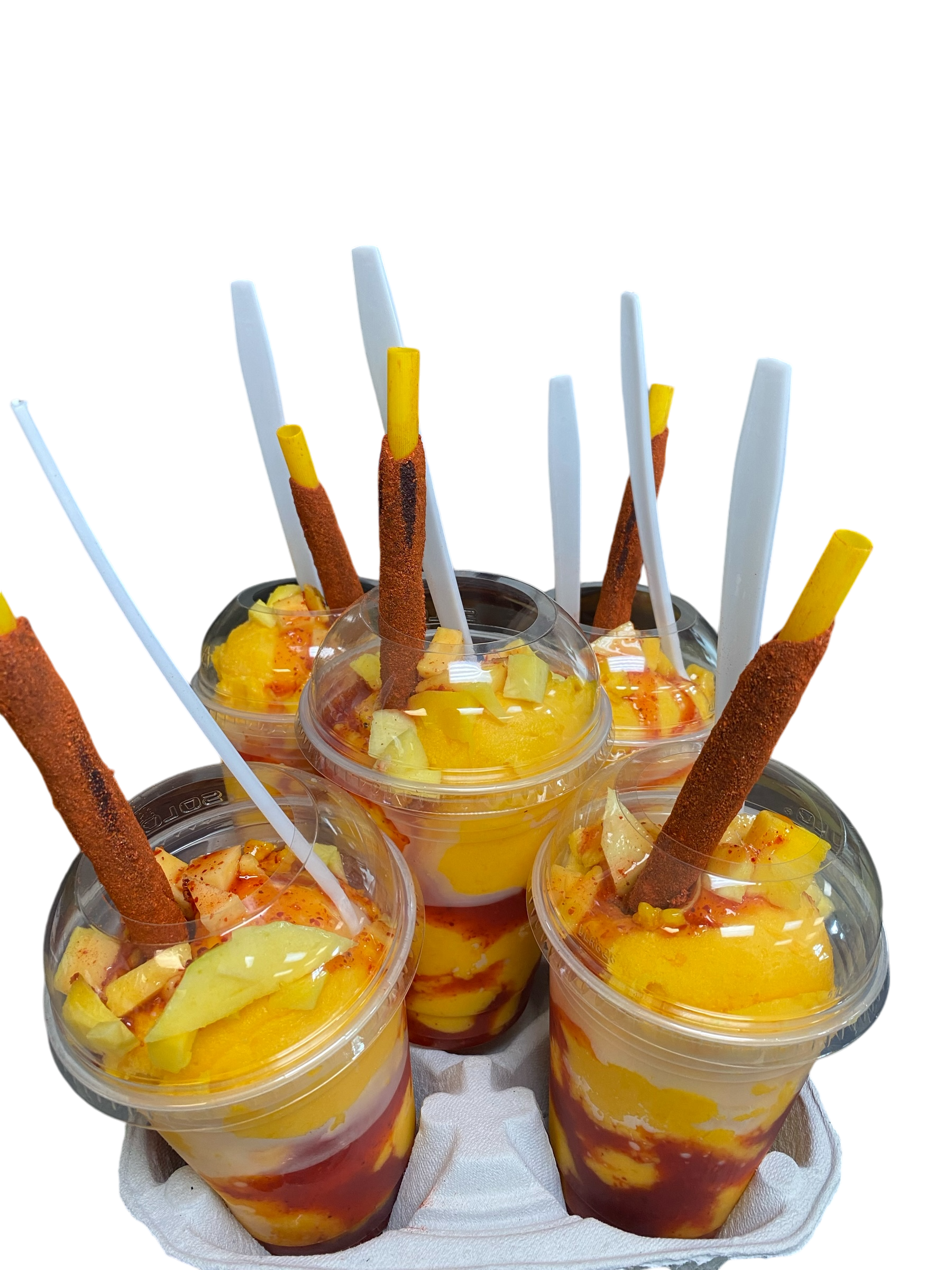 A group of cups filled with ice cream and straws.