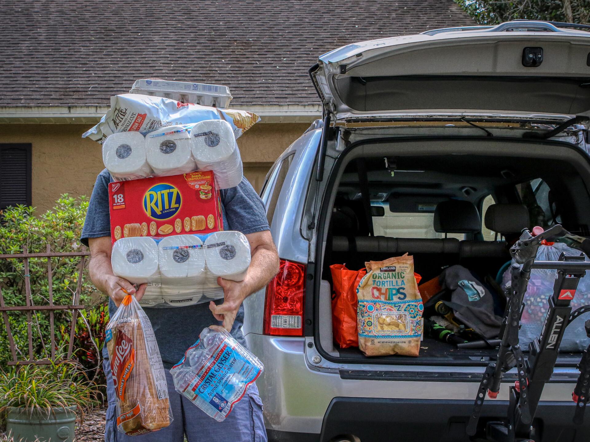 Homeowners gathering supplies before an impending storm.