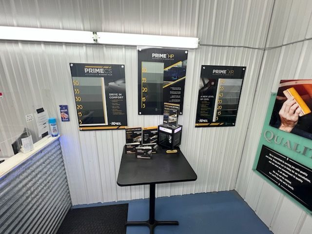 A small room with a table and posters on the wall
