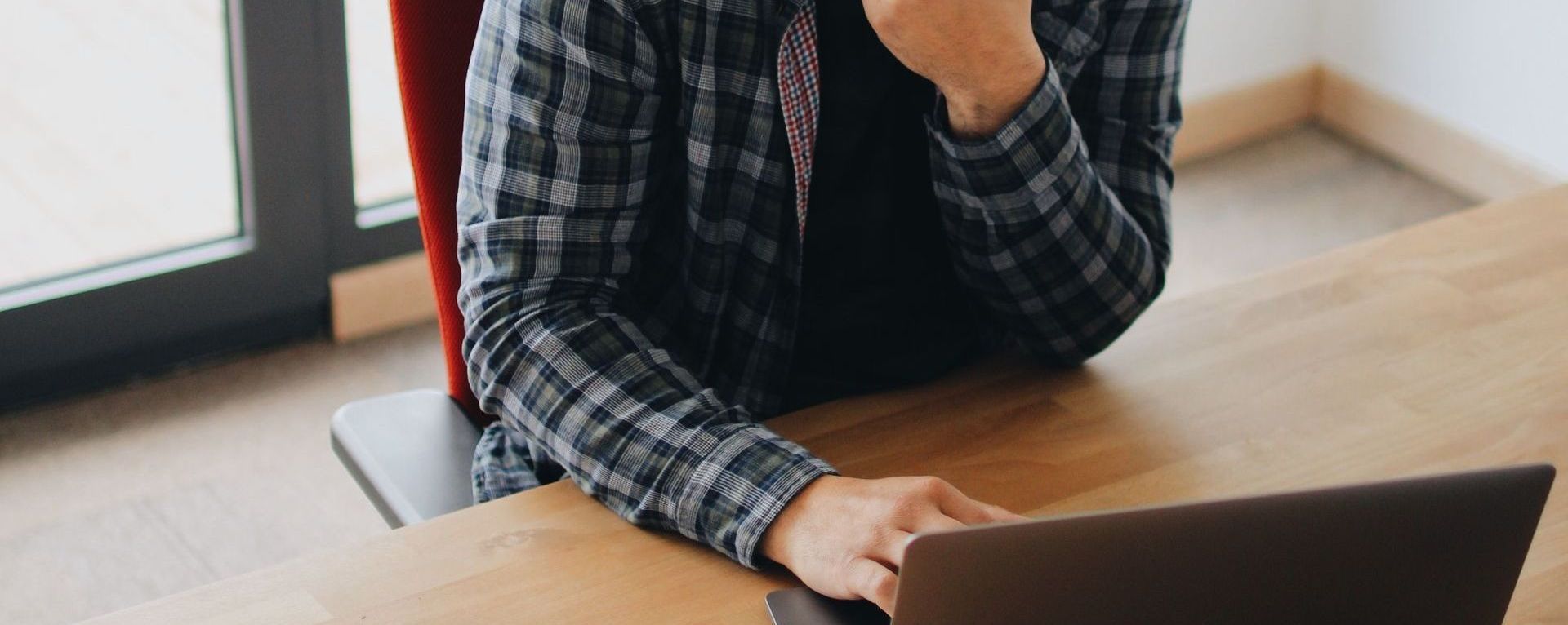 man sitting at table on laptop man sitting at table on laptop