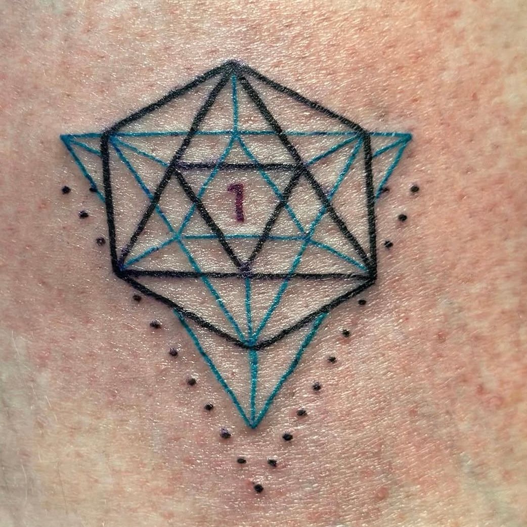Geometric tattoo with blue and black lines, central 
