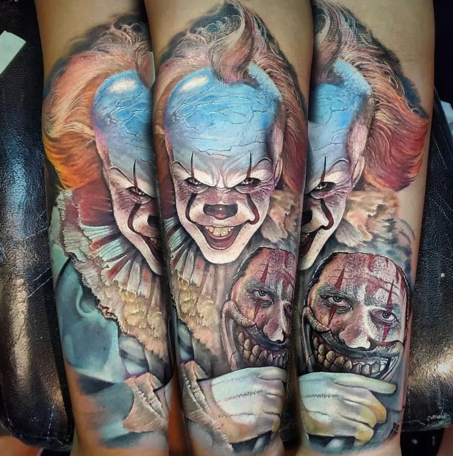 Tattoo of Pennywise the clown, with blue skin, red hair and frightening grin.