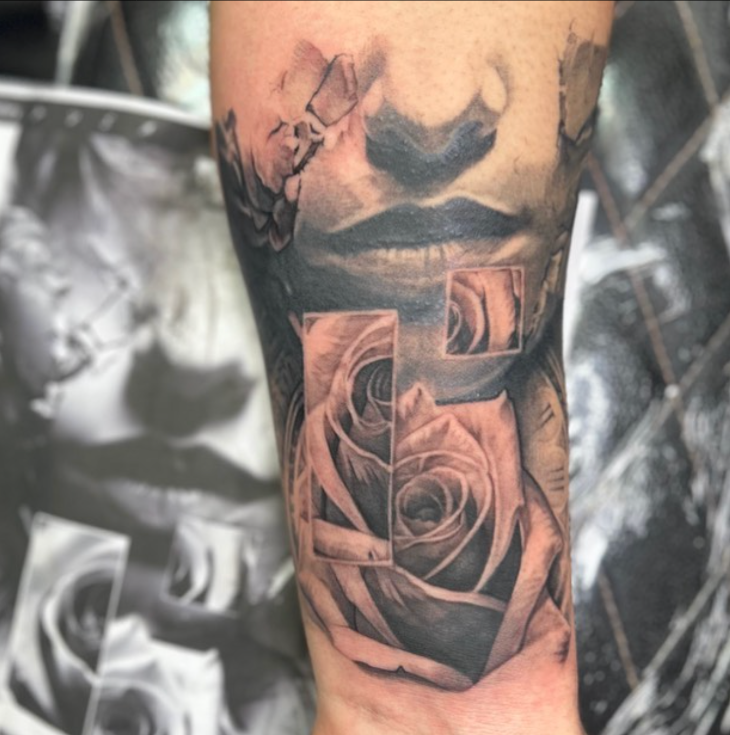 Black and grey tattoo of a woman's face and a rose with sections displayed in rectangular frames.