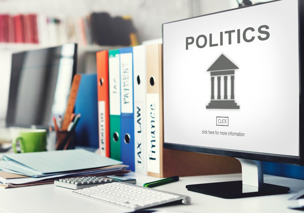 A computer monitor with the word politics on it