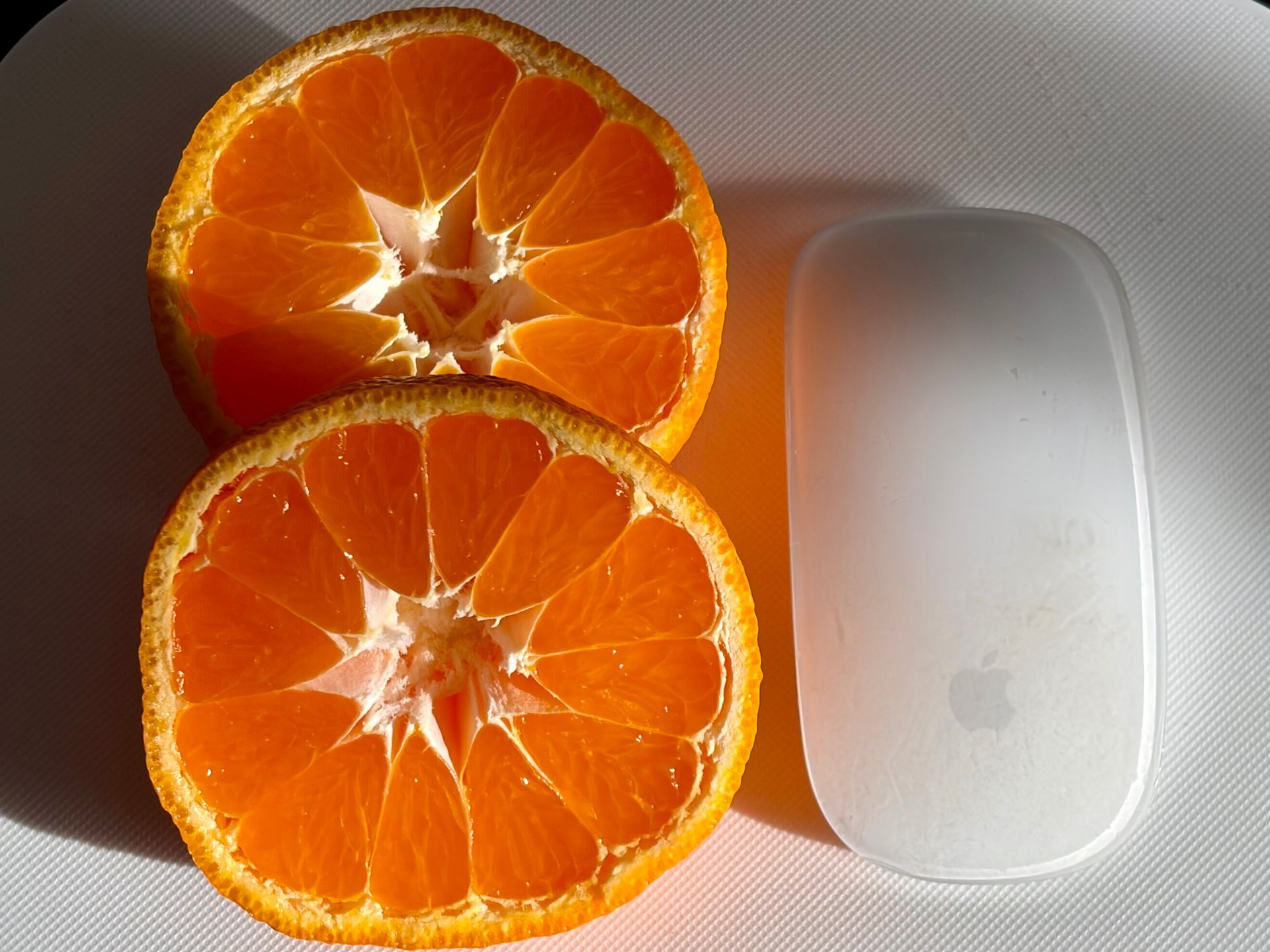 mandarin orange cut open to show juice and colour