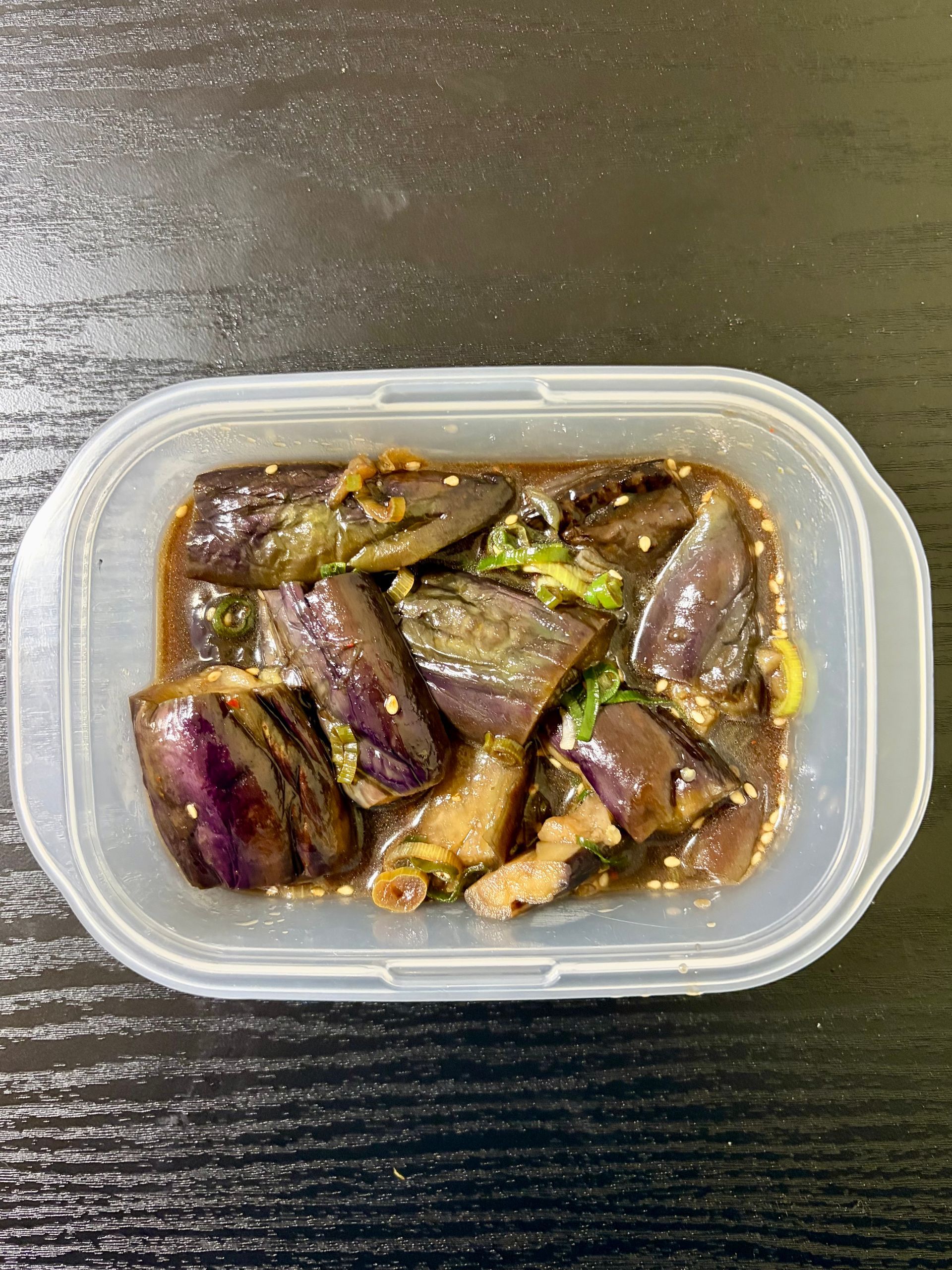 finished eggplant dish in container to be put in the refrigerator