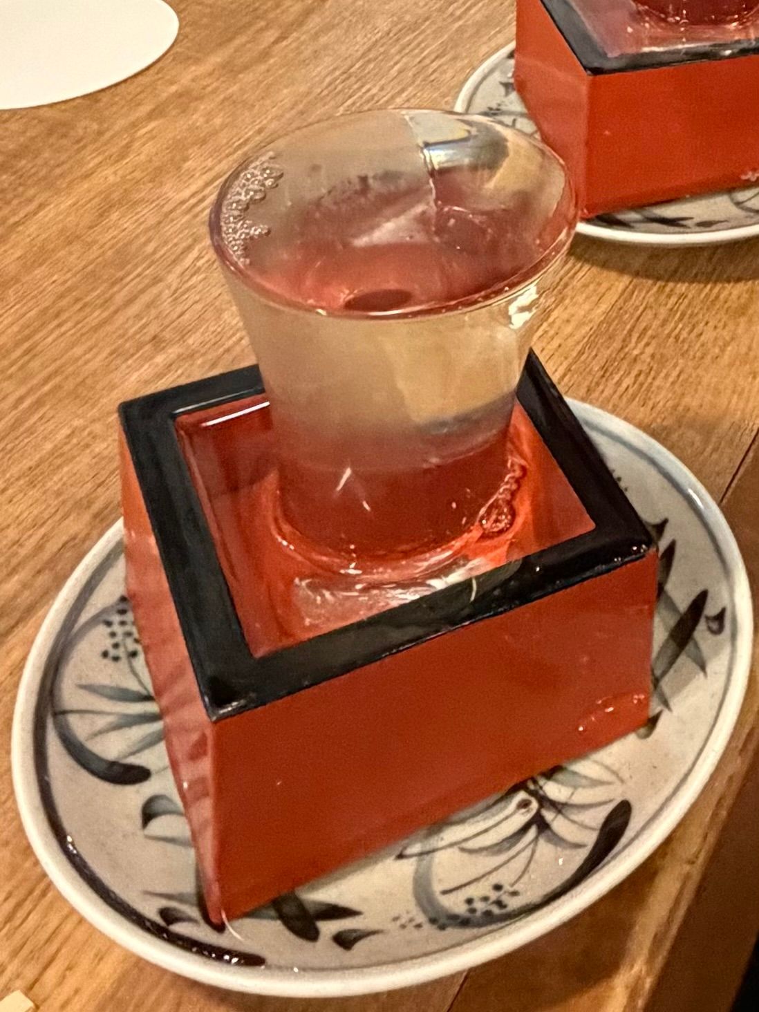 sake in glass, maze and small plate
