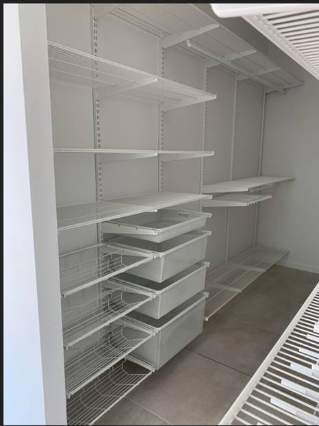 Empty White Wire Shelving Unit With Several Shelves And Drawers — Roll Edge In Manunda, QLD