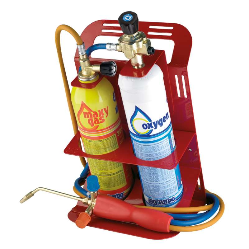 Bombole di ossigeno e carburante rosse con regolatore e tubo flessibile in un carrello metallico per saldatura.