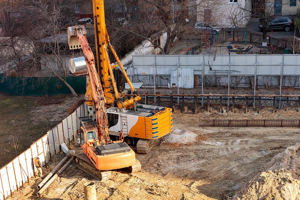 a construction site with a crane in the middle of it