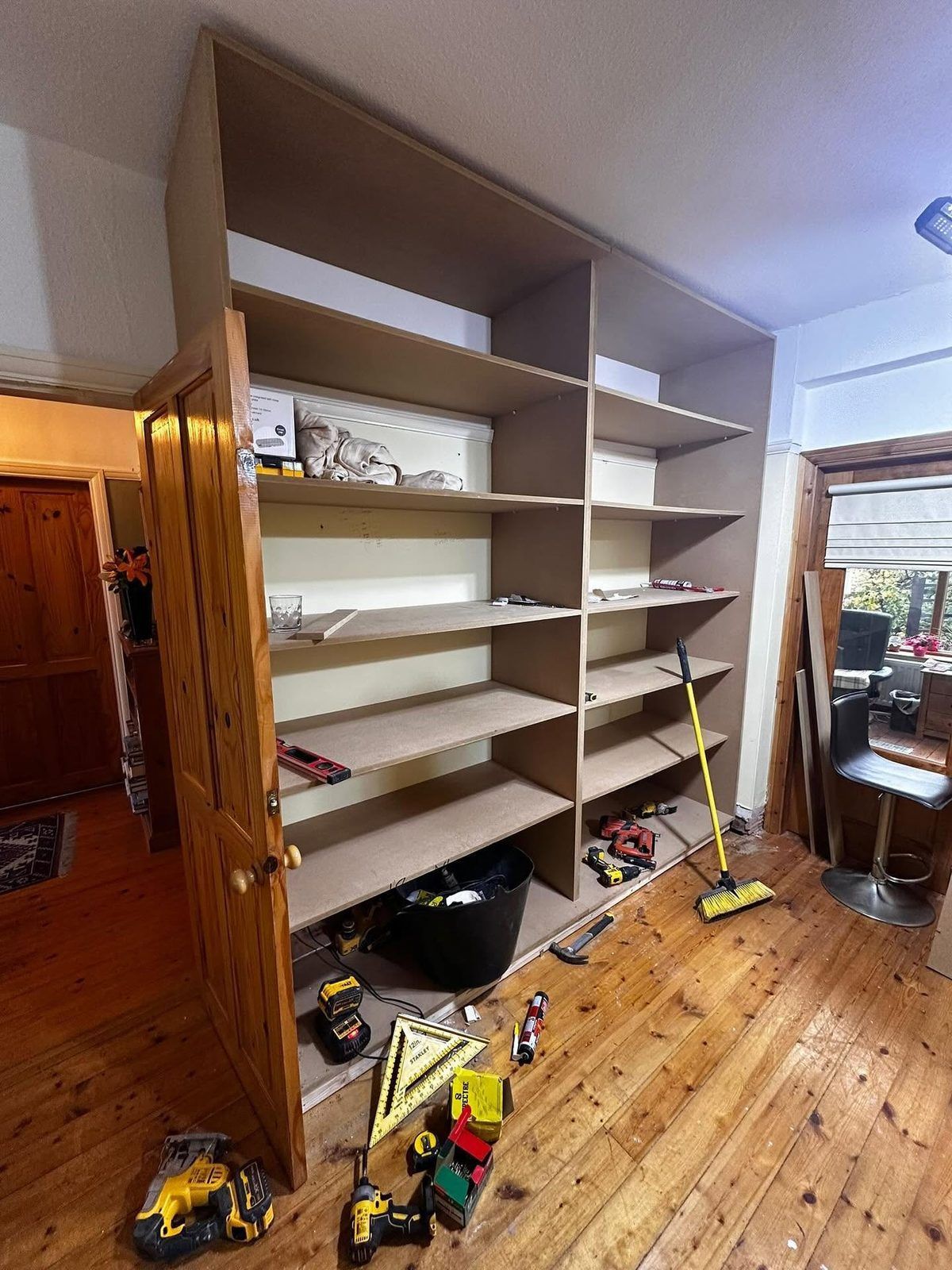 Made-to-measure storage carcass being built in the room by our joiners