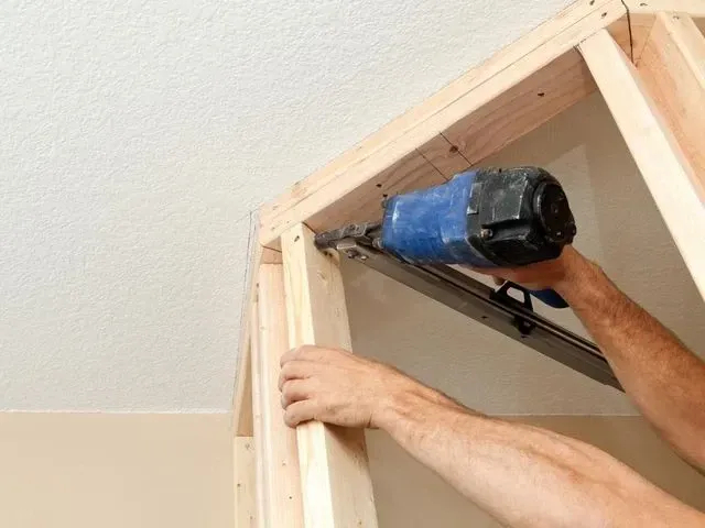 Derbyshire Joinery Specialists fitting a stud to a top plate for a new partition wall in Derby