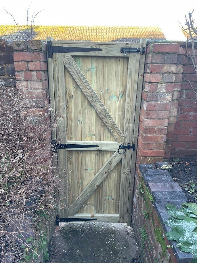 Derbyshire Joinery Specialists inside view of a wooden garden gate with lock