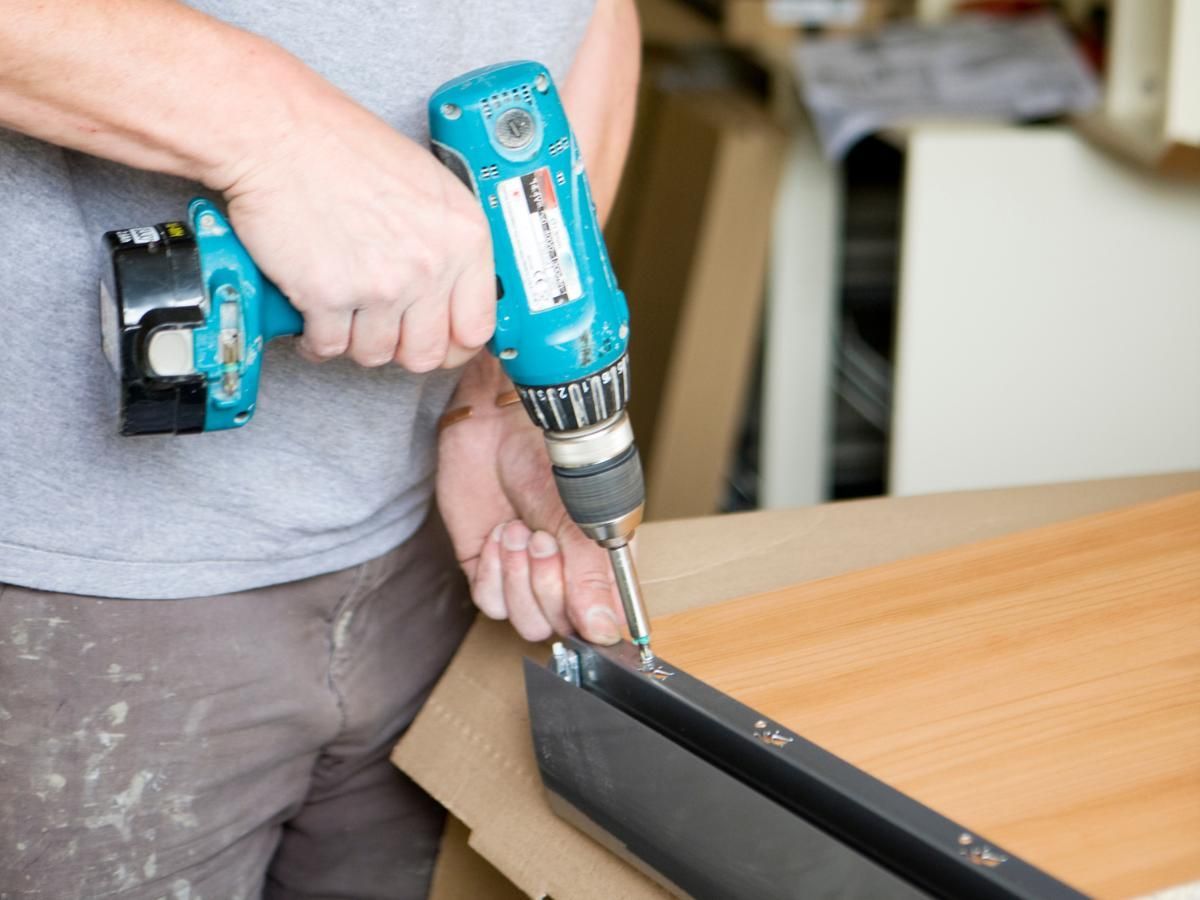 Derbyshire Joinery Specialists adding a rail to a kitchen draw