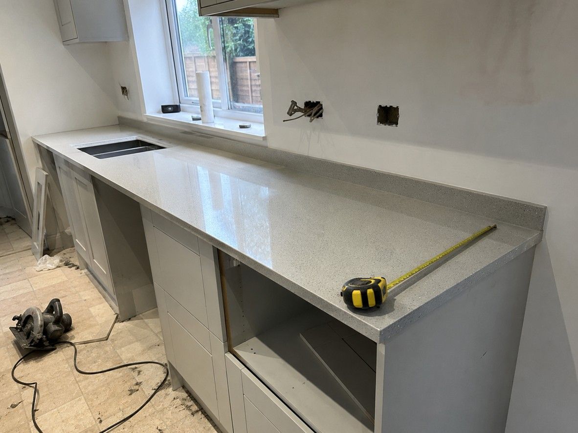 Kitchen worktop being measured and fitted by Derbyshire Joinery Specialists during a Long Eaton kitchen installation