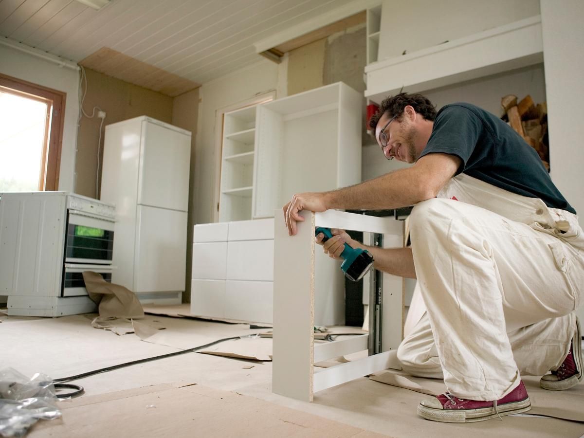 Derbyshire Joinery Specialists levelling a kitchen set of draws in Ashbourne