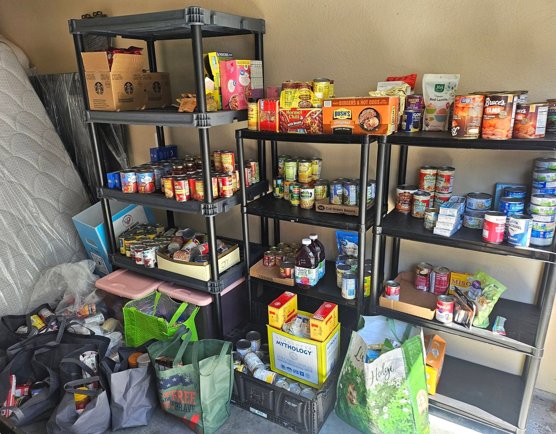 Shelves stocked with assorted canned and boxed food in a storage area
