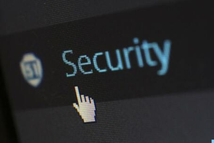 Picture of a black computer screen. The computer screen displays a white mouse hand symbol ready to click text saying security.