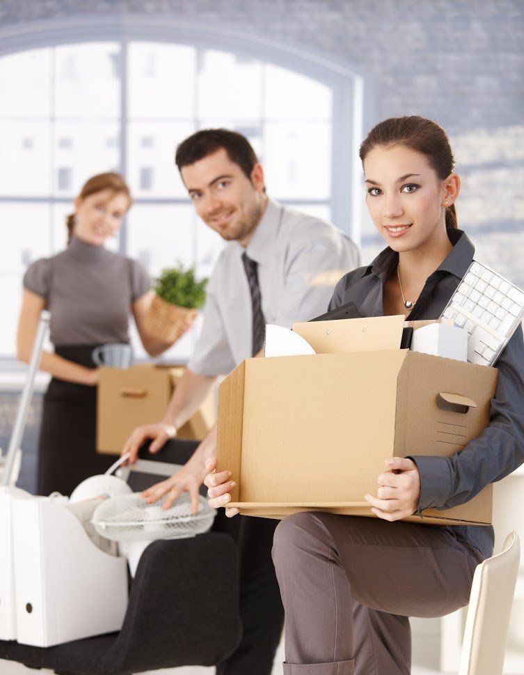 Office Workers Carrying Boxes — Bremerton, WA — United Moving & Storage Office Workers Carrying Boxes — Bremerton, WA — United Moving & Storage