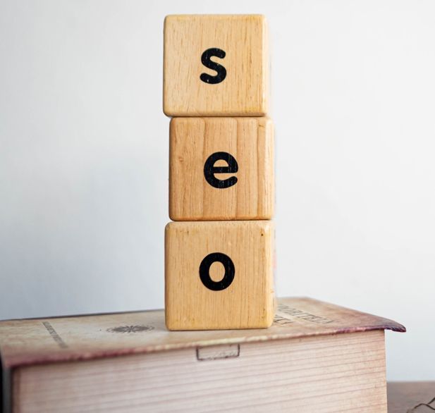 Wooden blocks stacked on top of each other with the word seo written on them