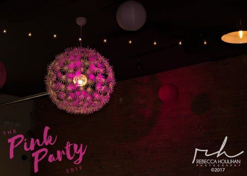 Pink floral sphere light fixture hanging at