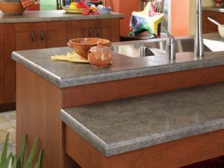 A kitchen with a sink and a bowl on the counter