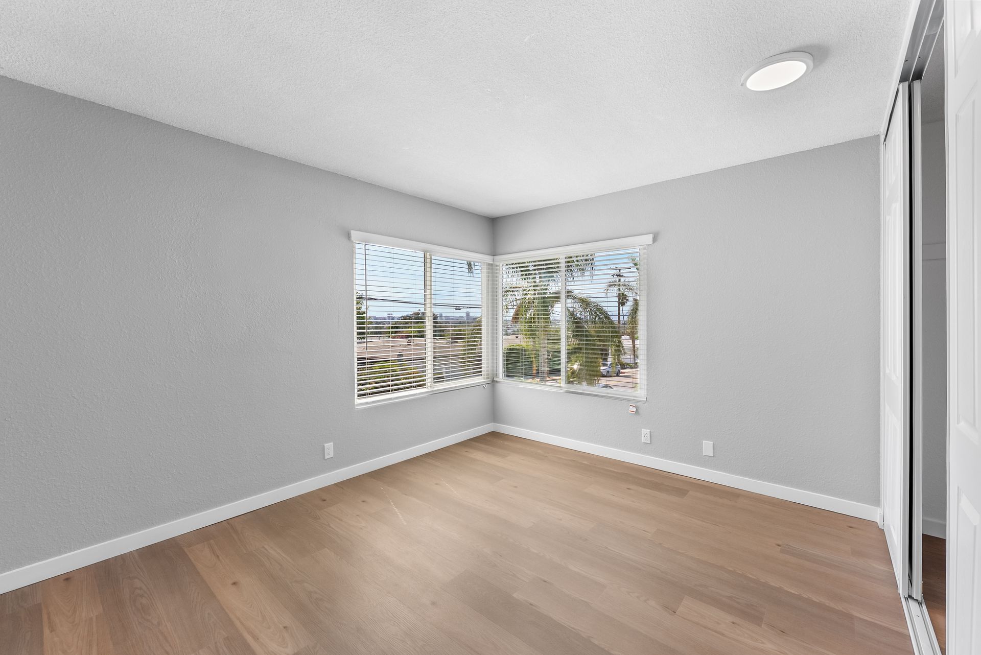 apartment bedroom with large windows