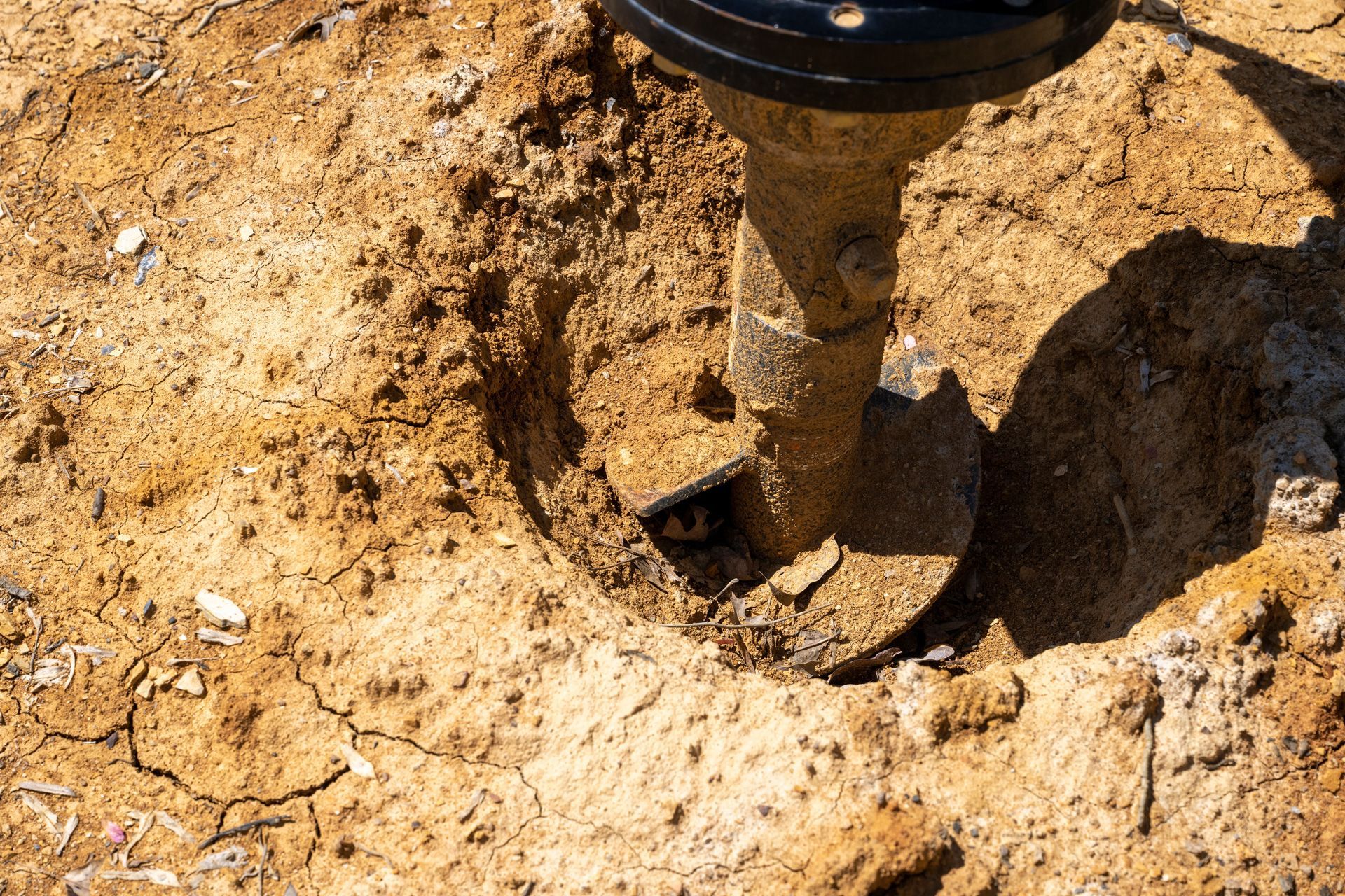 a drill is digging a hole in the ground