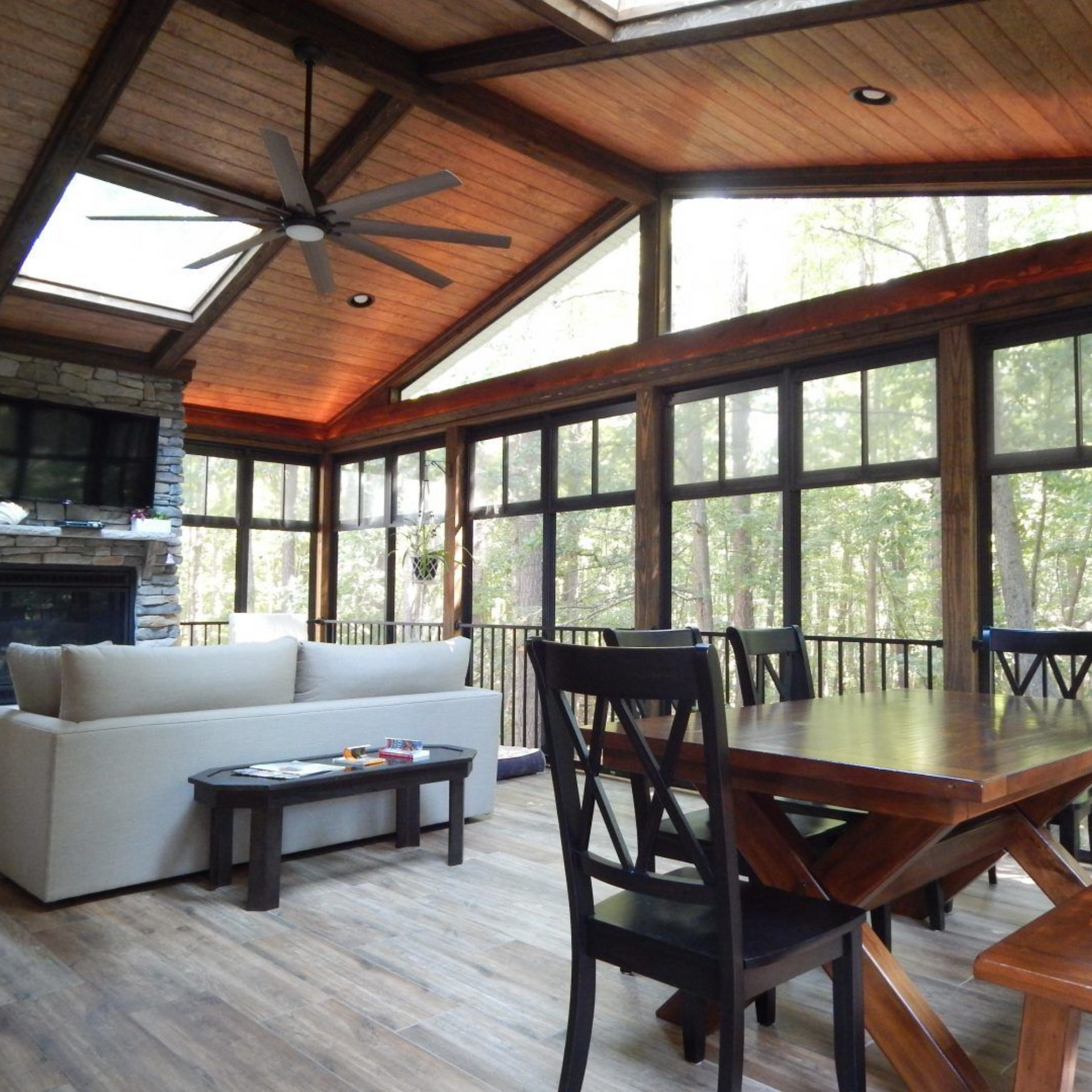 A living room with a couch a table and chairs