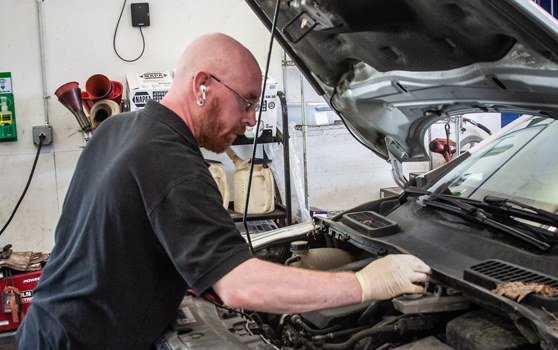 Our Expert Technician at work in our garage in Belfast, ME | BJ’s Automotive Diagnostic Center