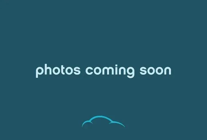 Blue placeholder screen with white text “photos coming soon” and a small cloud icon at the bottom.