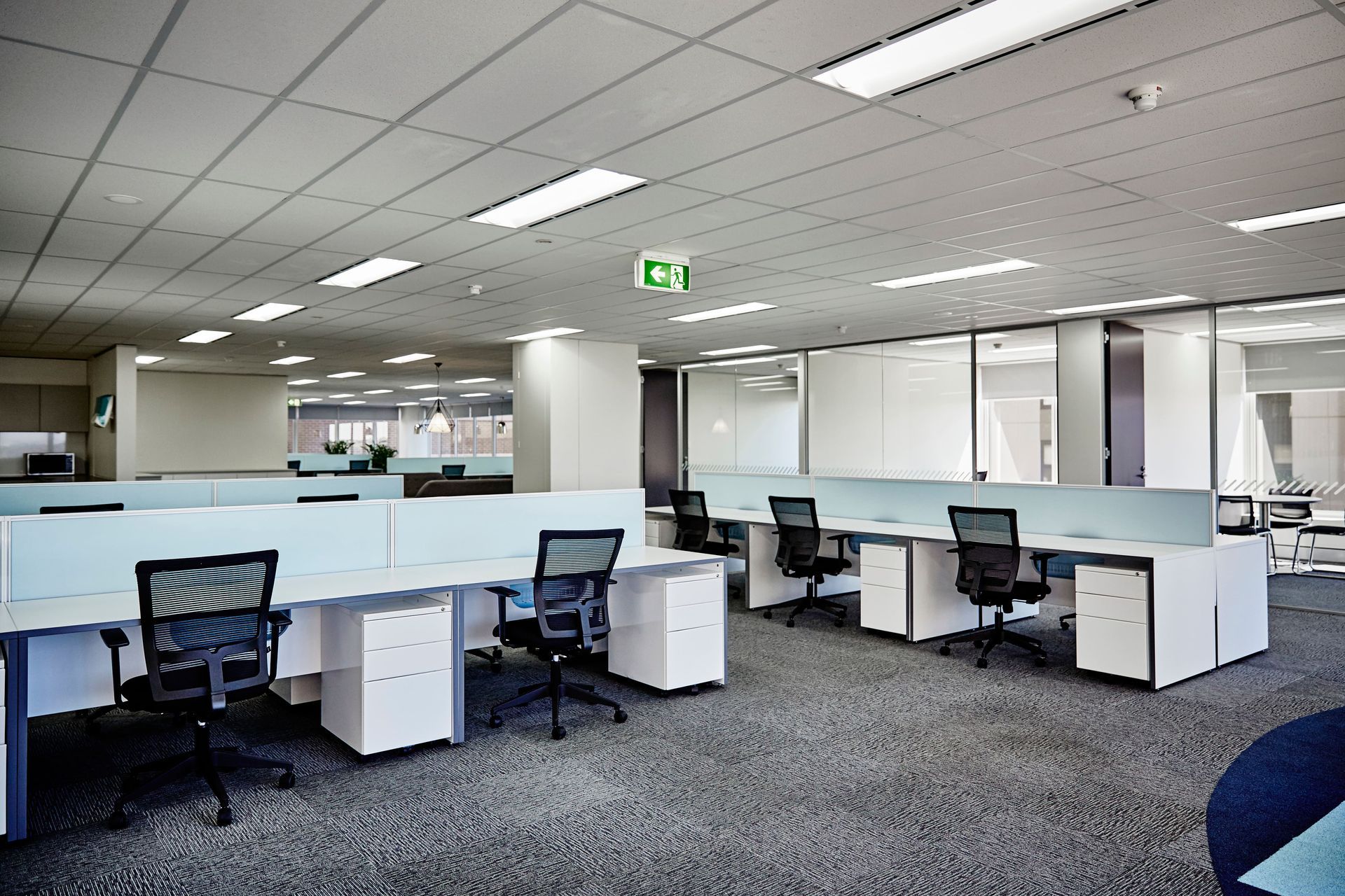 A large office with a lot of desks and chairs