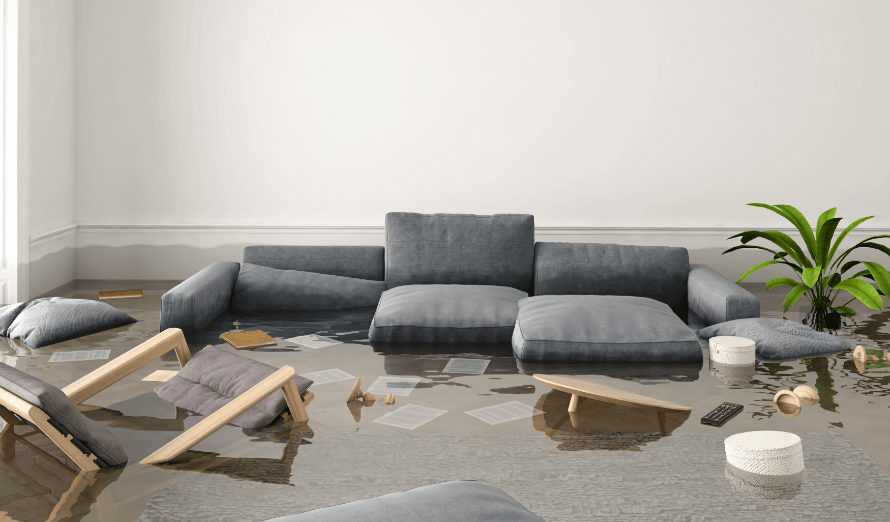 A living room with a couch and chairs covered in water.