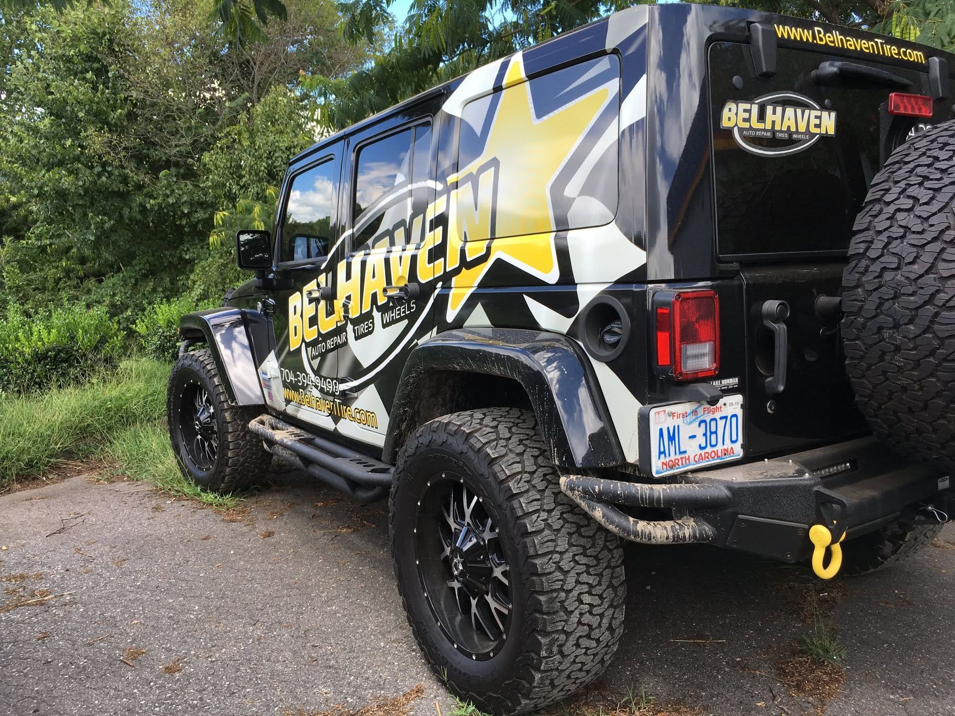 Branded Jeep Wrangler Parked Outdoors | Belhaven Tire And Auto