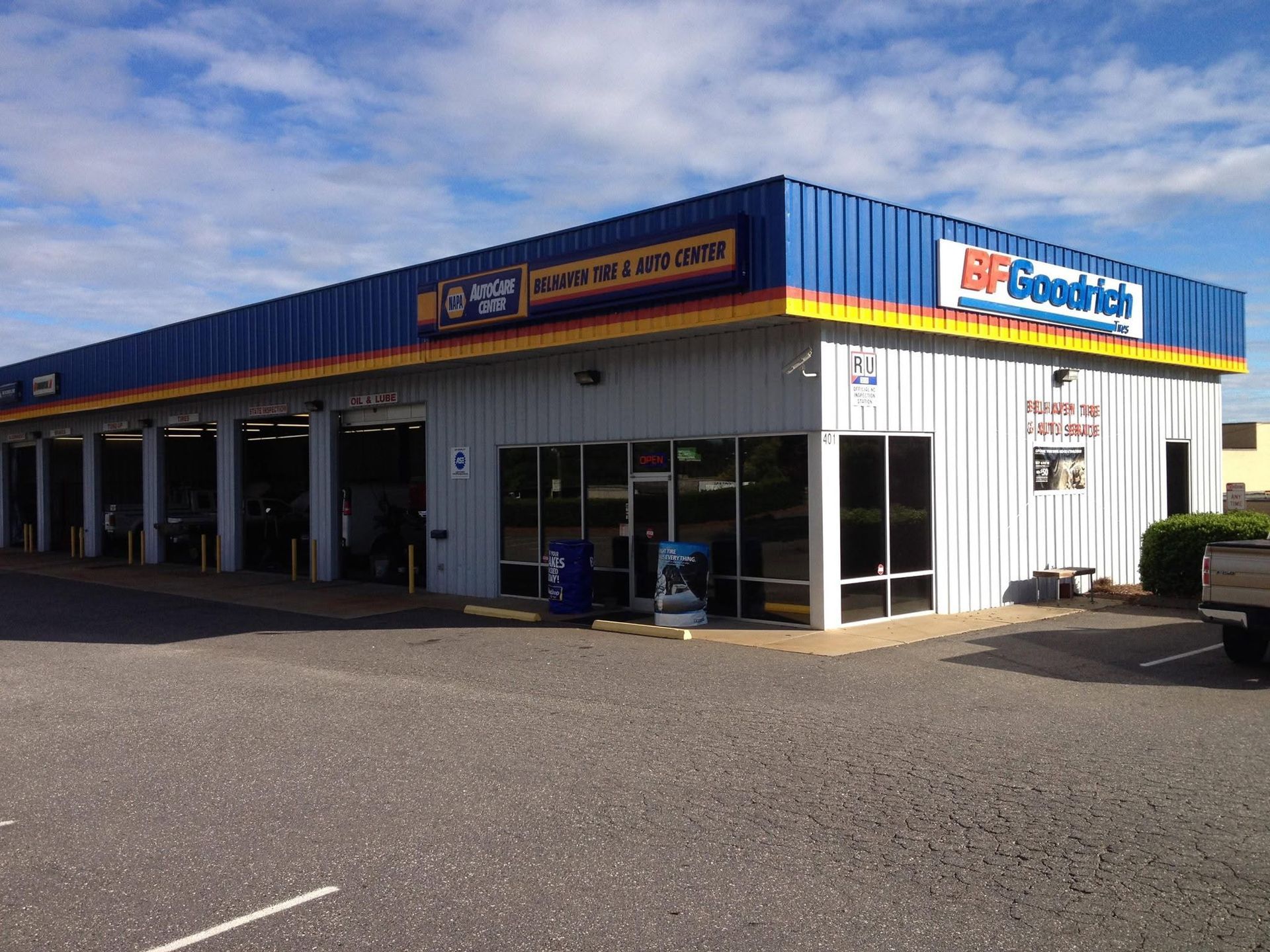 Angled Exterior View With BFGoodrich And NAPA AutoCare Signage | Belhaven Tire And Auto