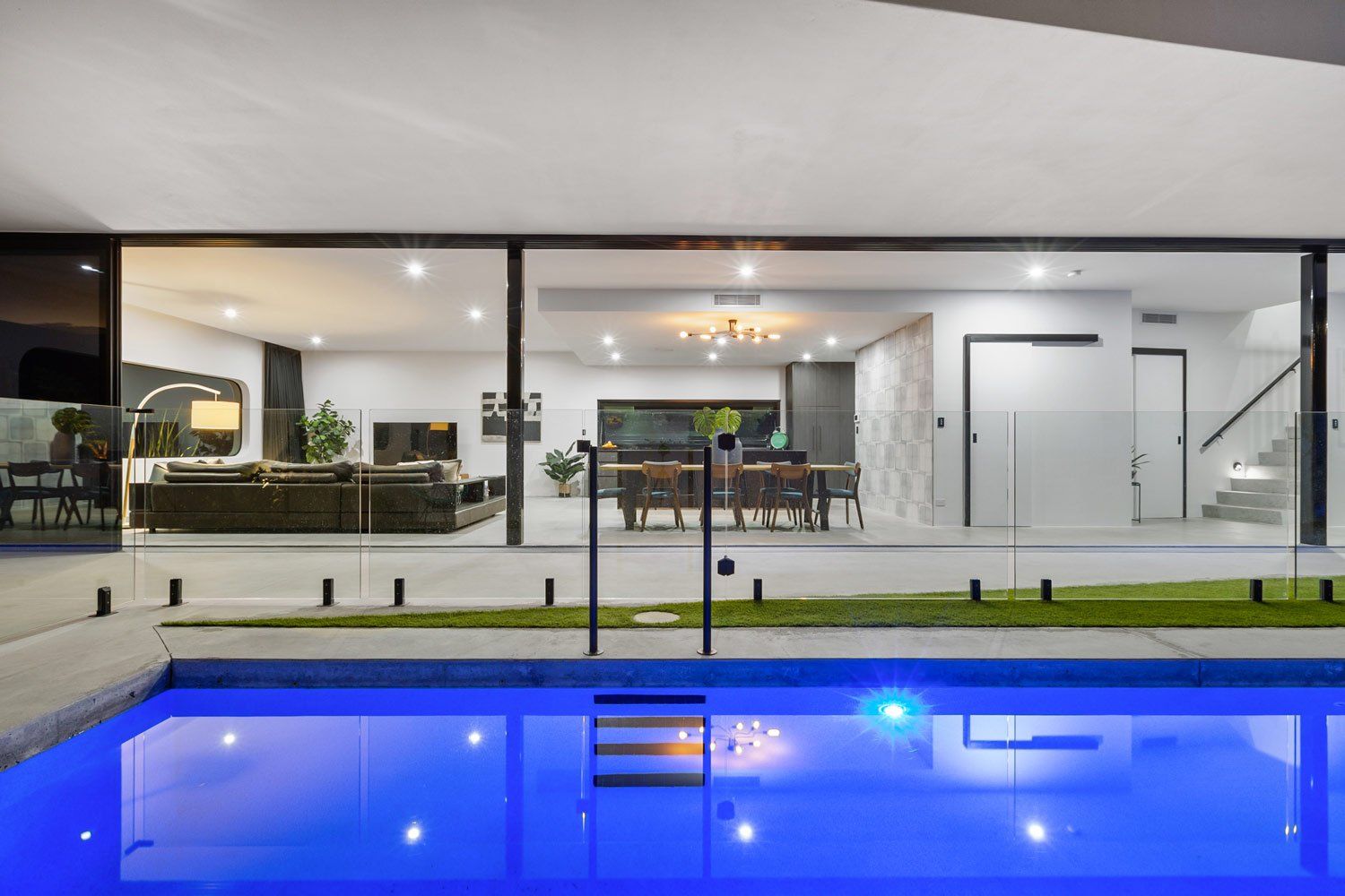 Pool and Entertaining Area At Night — Quality Swimming Pools in Coolangatta, QLD
