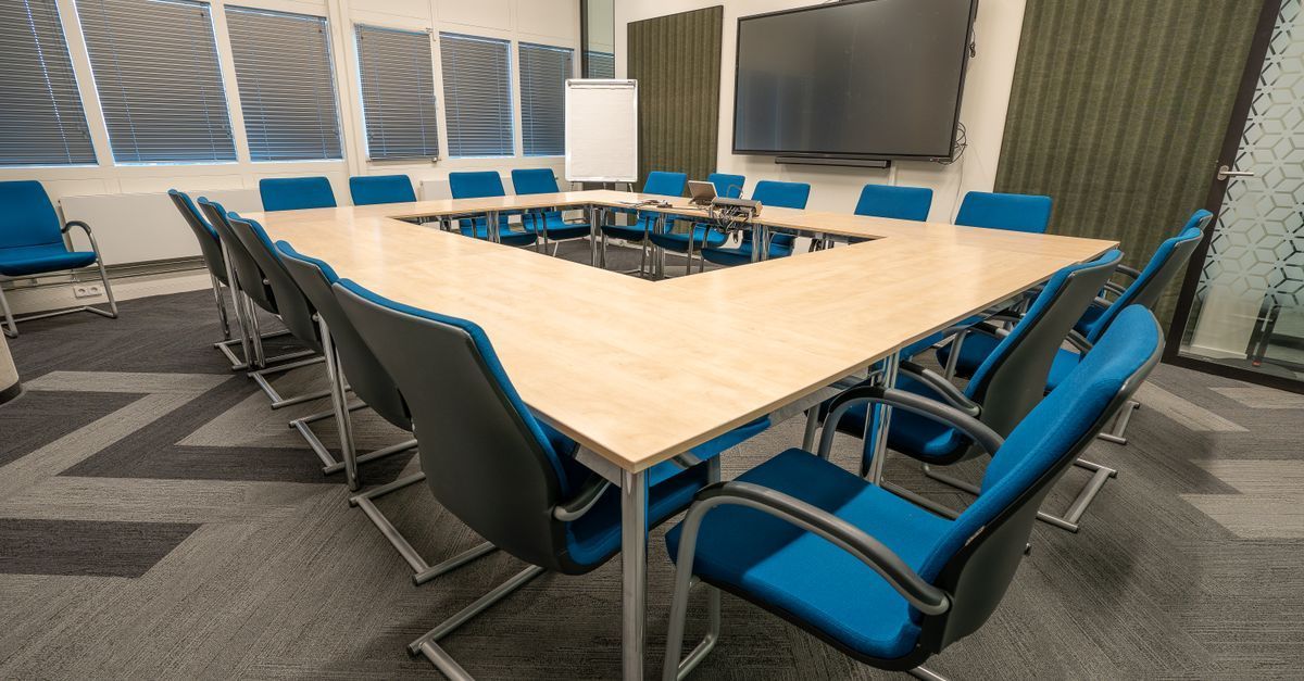 Modern commercial conference room with professional AV display and integrated technology