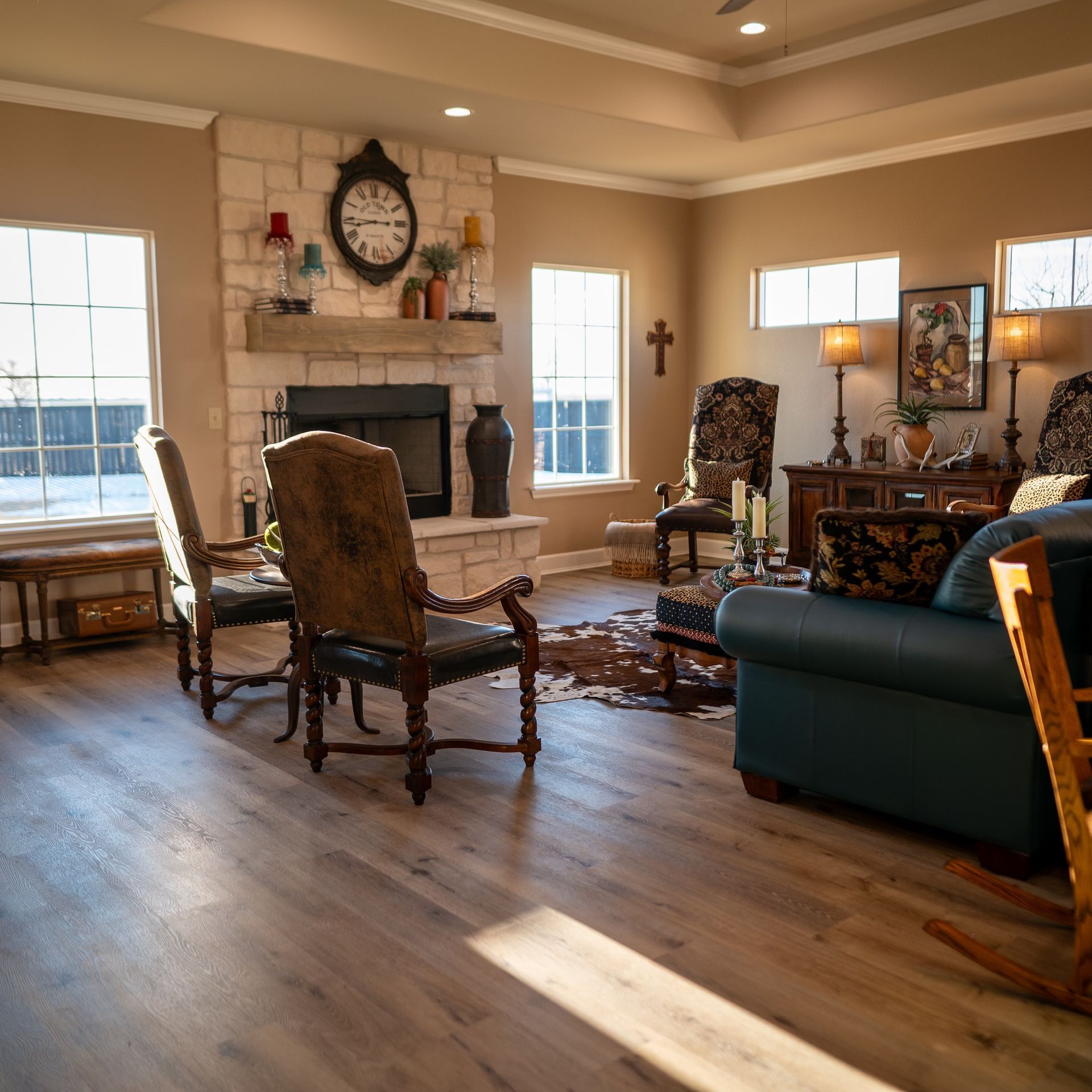 A living room with a clock above the fireplace