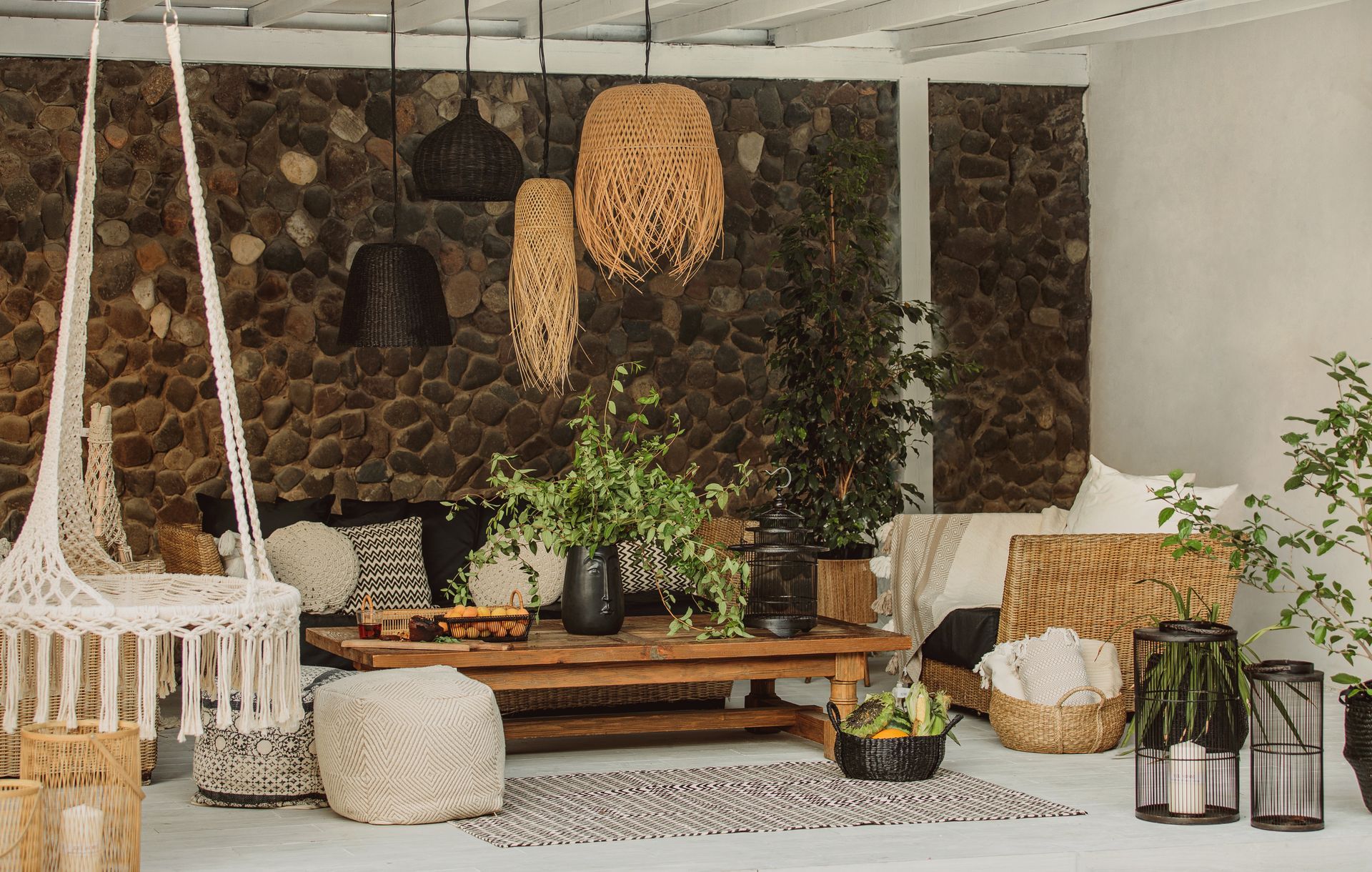 A living room with a couch and chairs and a table