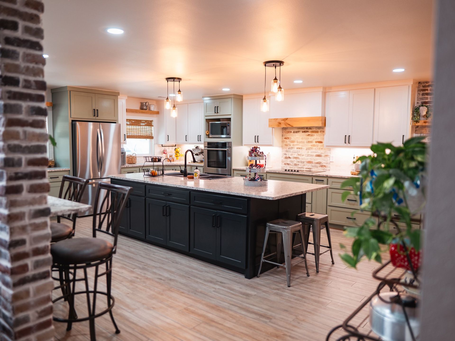 A kitchen with a large island in the middle of the room.