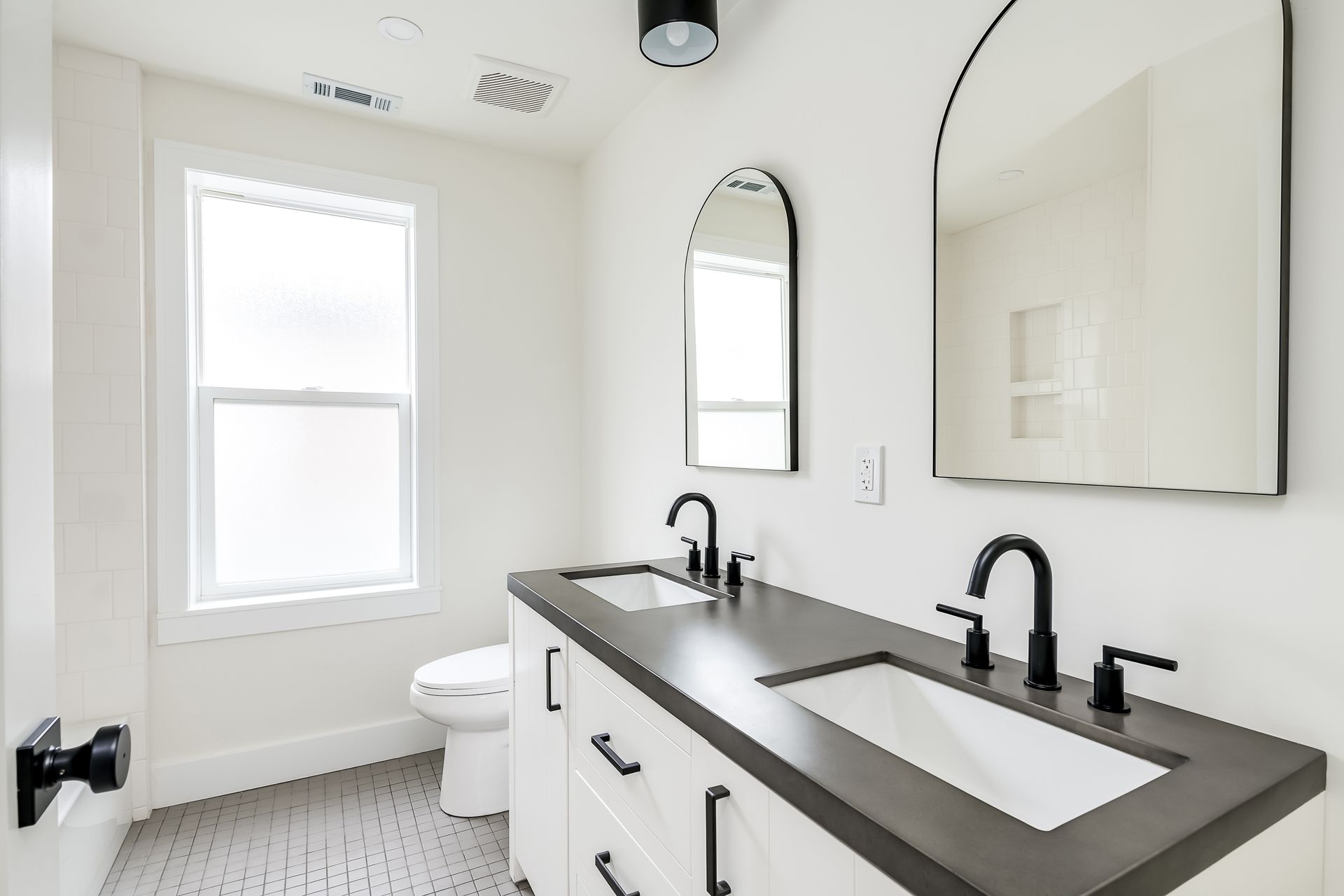 A bathroom with a toilet , sink , and shower.