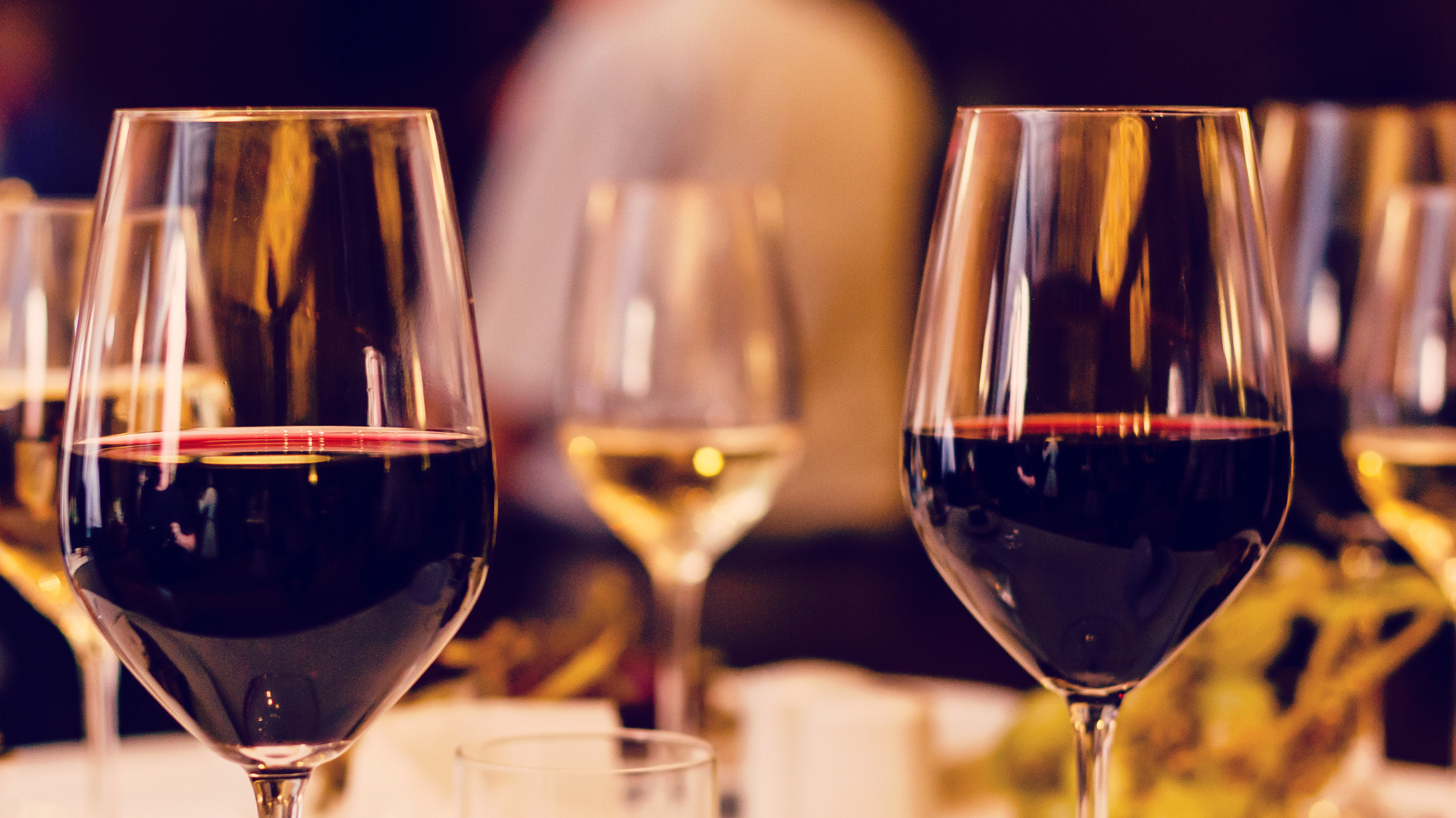 two glasses of wine are sitting on a table
