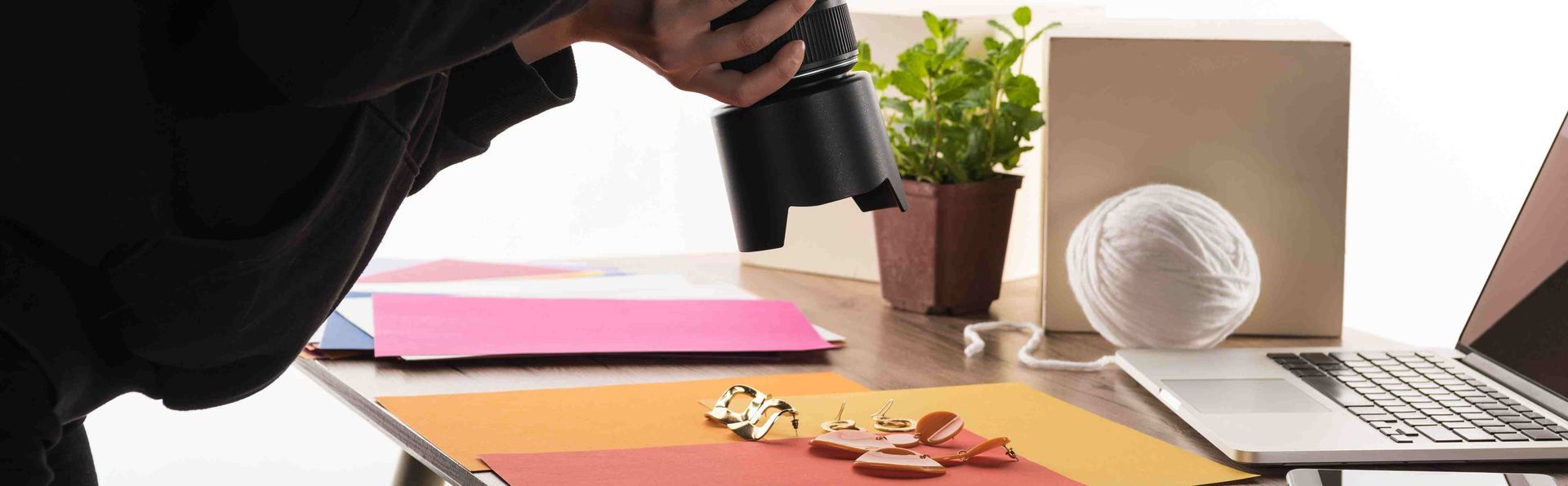 A professional photographer taking photos of jewelry
