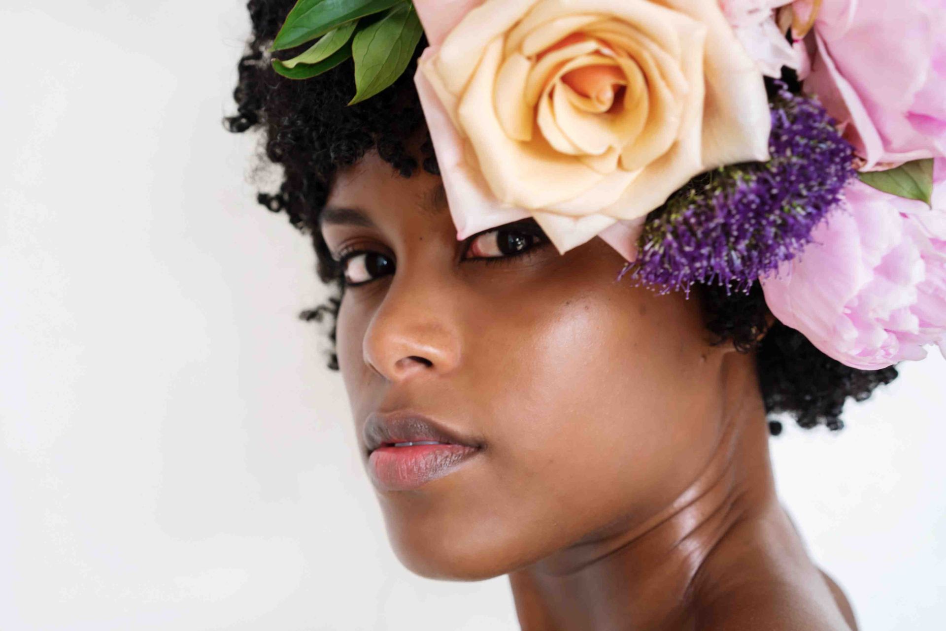 An Amarillo woman with flowers in hair artistic photo taken in our Amarillo studio