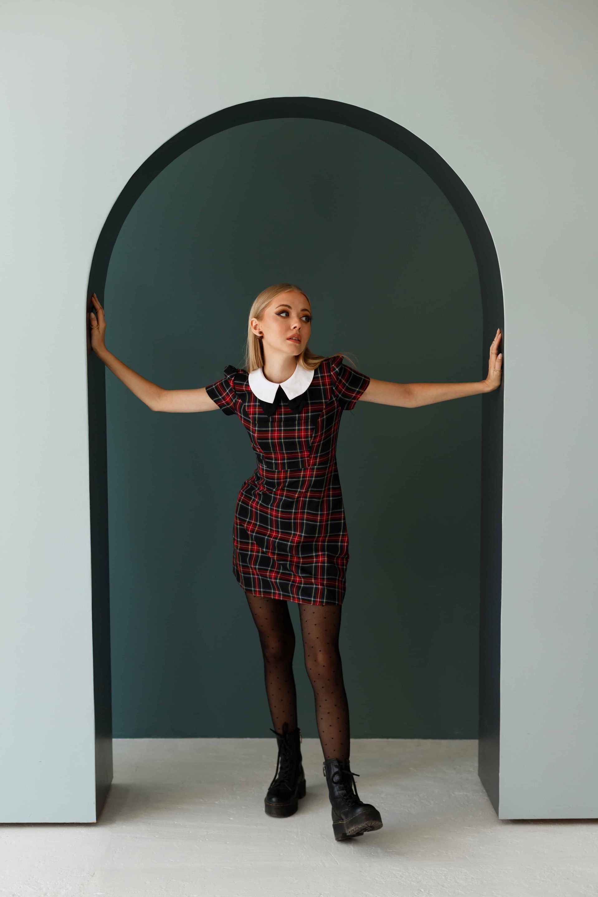 A woman in doorway in our Amarillo, Texas, portrait studio, captured by our photographer