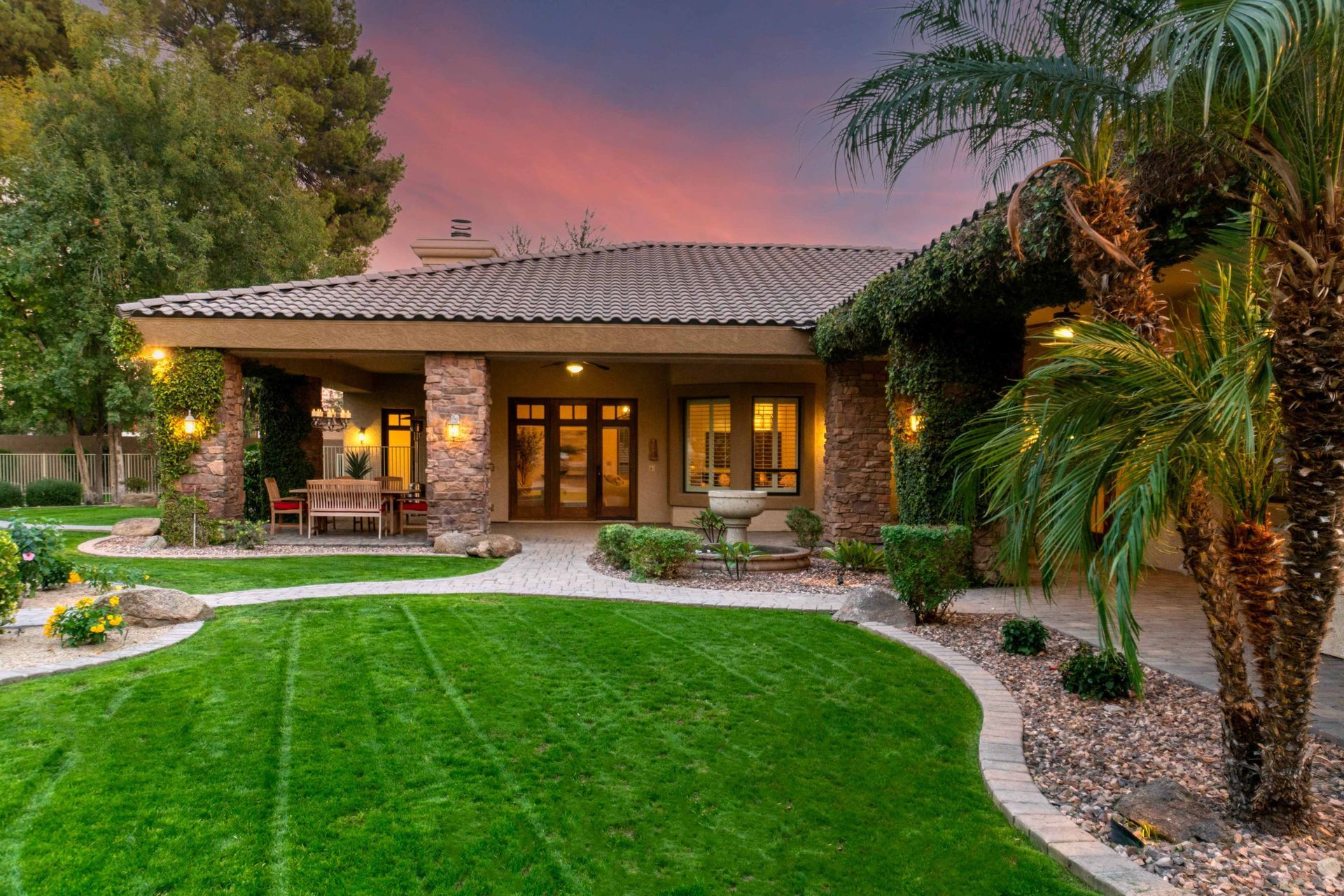 Exterior real estate photo of a yard and front of home