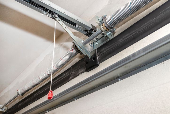Springs tensioning the home garage door mechanism