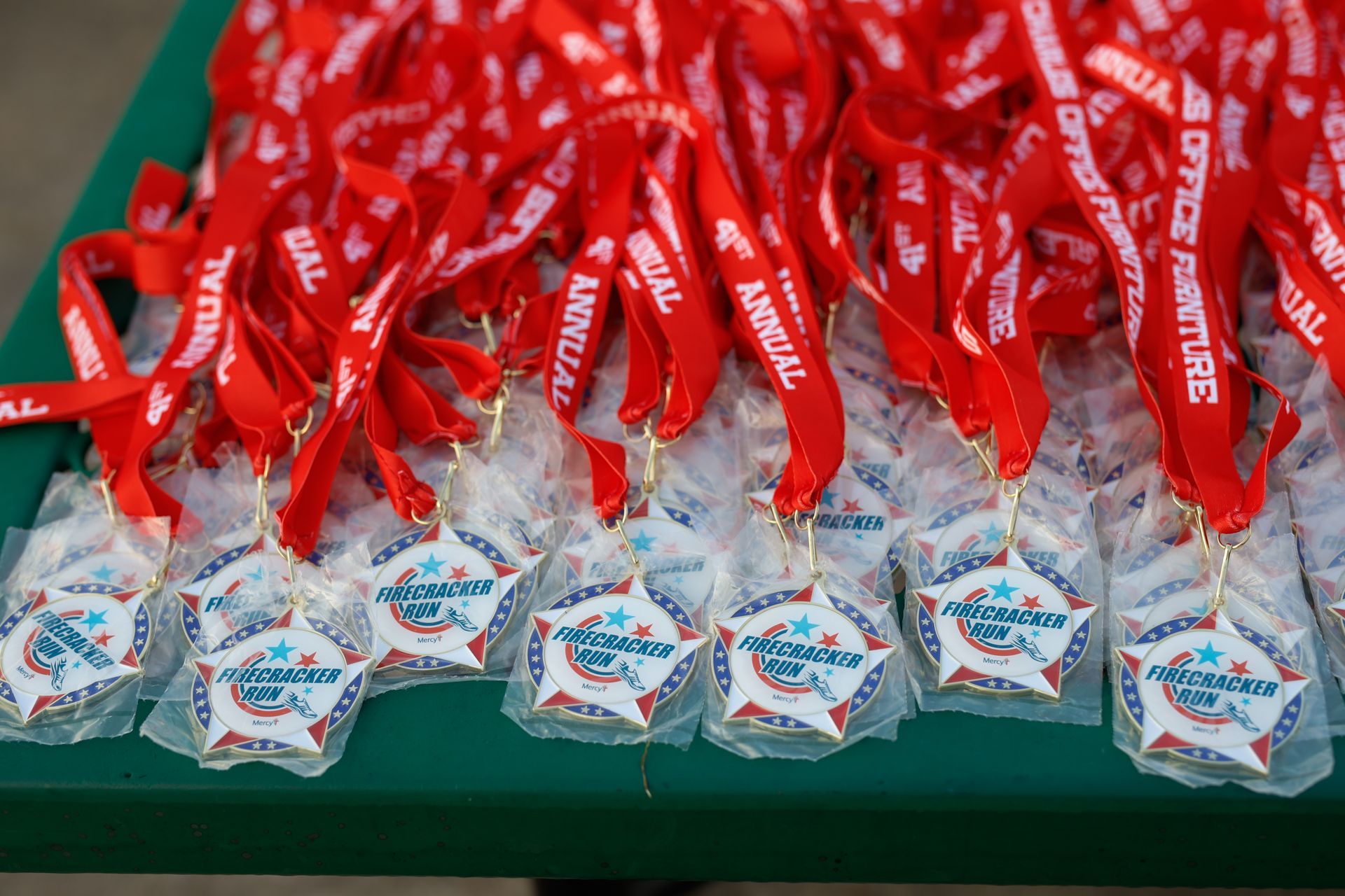 A firecracker run medal is sitting on top of a table.