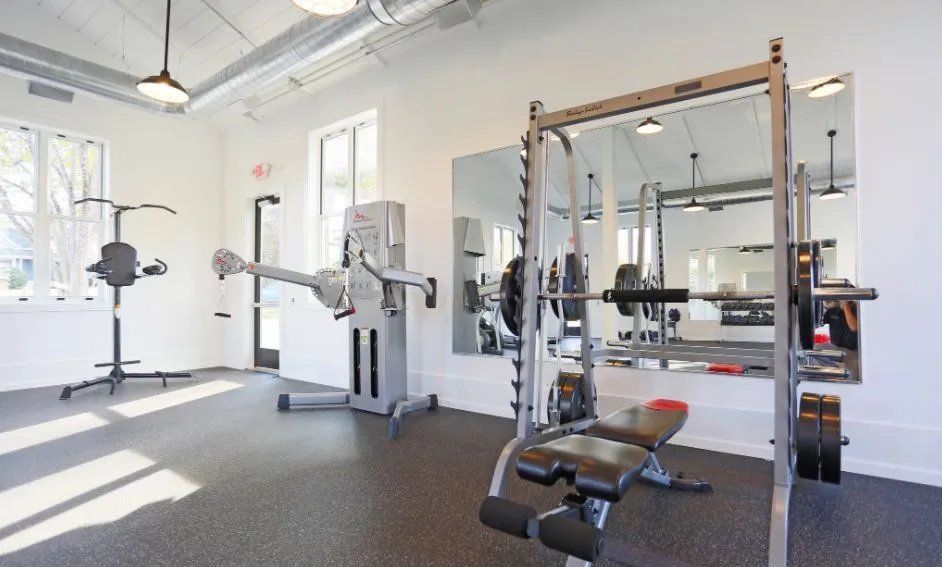 Modern gym equipped with fitness machines and weights