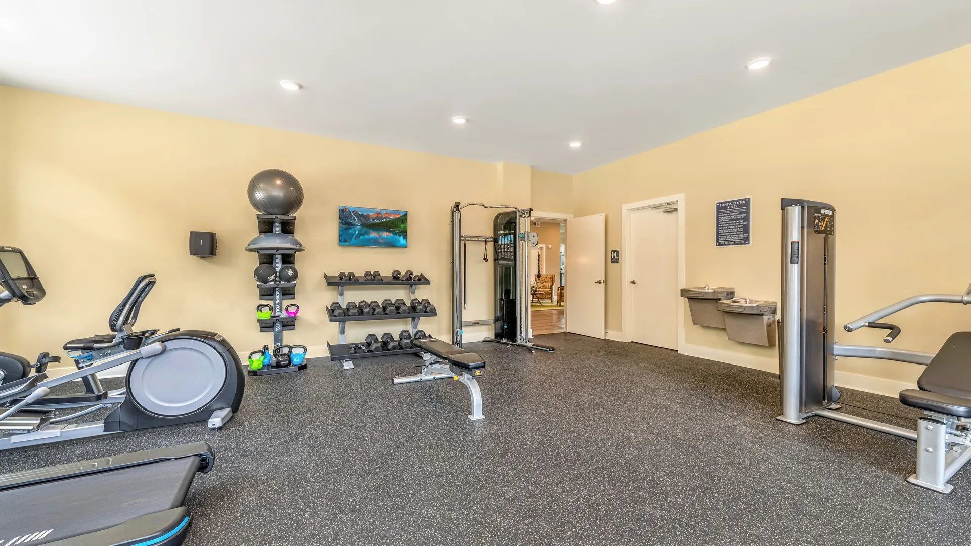 Interior view of a modern fitness center with exercise equipment